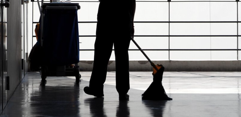 Neon Clean technician performing gutter cleaning at a business in Ventura, CA